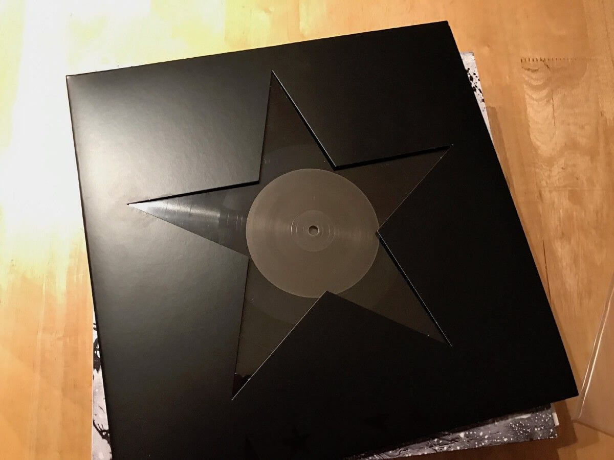 a black rectangular object with a white circle on it